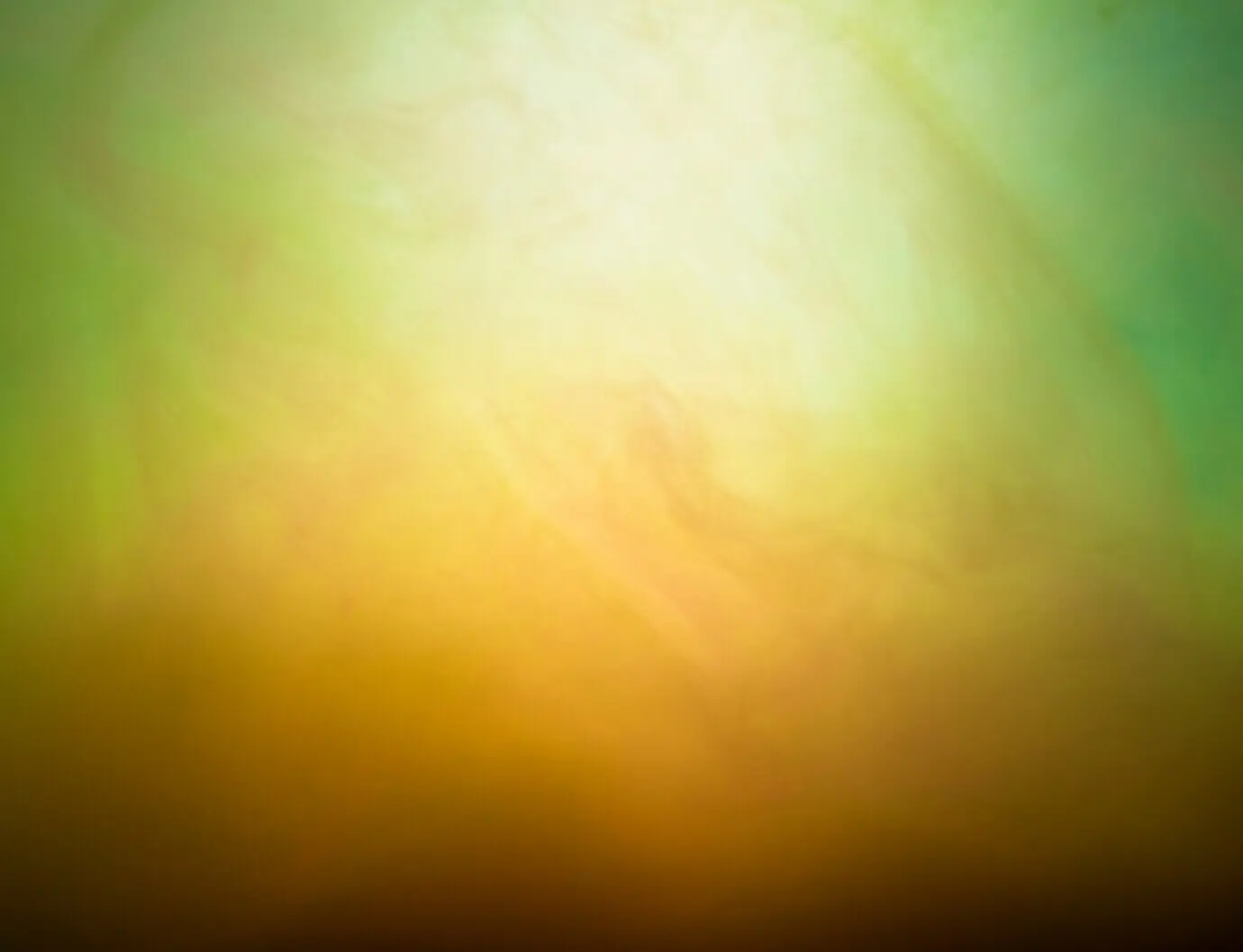 An abstract green and yellow haze cloud.